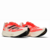 Um par de tênis de corrida Adidas Adizero Prime X nas cores branco e vermelho solar, com detalhes em preto e sola destacada.