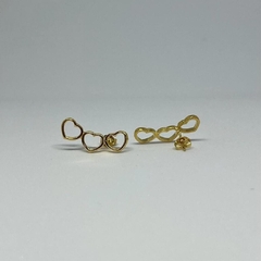 Brinco ear cuff corações vazados - banho ouro na internet