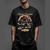 Camiseta unissex preta com estampa de uma moto estilo Harley Davidson e a frase "The Legend".