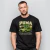 Homem vestindo camiseta preta oversized com estampa de carro clássico brasileiro verde e texto Puma GTB 1976