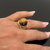 Anel com Pedra Natural Redonda de Olho de Tigre na internet