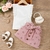 Imagem do Conjunto blusa branca com babados e saia rosa com botões e estampa floral