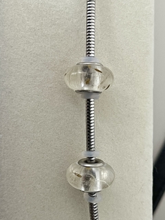 Berloque charm dente de leão na internet