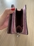 Monedero rosa metálico Coach en internet