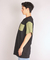 Remera Over Negra con Manga y Bolsillo Verde en internet