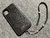 Funda/Soporte iPhone. 2 Terminales Cuerda, 1 Pasador Cuerda, 2 Eslabones, 1 Calavera y 6 Argollas, Plata 925 & Correa 3 cabos, Marrón o Negro.- KP03i - B|A|B Leather Goods