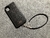 Funda/Soporte para iPhone/Samsung. 2 Terminales Espiral, 2 Eslabones y 6 Argollas, Plata 925 & Correa/Gargantilla/Pulsera Cuerda Elástica Negra.- KP99