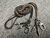 2 Terminales Espiral, 1 Pasador Espiral con Argolla y 1 Crucifijo, Plata 925 & Crossbody Cuero Genuino tres cabos trenzados a mano, Marrón/Negro.-CP31 - B|A|B Leather Goods