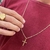 Corrente Cartier 2mm Com Pingente Cruz Palito Detalhe Banhada a Ouro 18k - comprar online