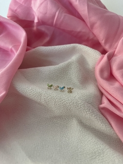 Broquel oro con mariposa ziriconia azul - comprar en línea