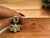 Brinco Jade Meia Flor com Pedras de Zircônias Coloridas Banhada a ouro 18k - comprar online