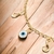 Pulseira Carmem em Malha de Elos Português com Pingente do Infinito e Olho Grego