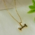Colar com Pingente de Osso com Ponto de Luz Banhada a Ouro 18K - comprar online