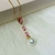 Corrente com Pingente Cristais Pink e Pérola Banhada a Ouro 18k - loja online
