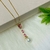 Corrente com Pingente Cristais Pink e Pérola Banhada a Ouro 18k