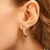 Argola Tubular Torcida Banhada a Ouro 18k - comprar online