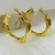 Argola Tubular Torcida Banhada a Ouro 18k - loja online