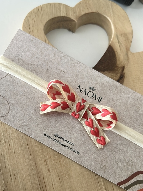 Faixinha de Bebê com Laço de Corações Vermelhos - comprar online