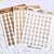LETRAS CARITAS CAFÉS | Sticker Sheet - comprar en línea