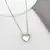 Colar Relicário Coração com Micro Zircônias Cristal - Semijoia Ródio Branco - comprar online