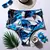 Calcinha biquíni modelo hot pants em tom azul com estampa floral de flores azuis. Possui cintura alta e forro completo para evitar transparência.
