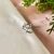 Piercing com detalhes em zircônias l Banho de prata
