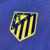 Escudo do Atlético de Madrid em amarelo aplicado na camisa reserva 2025/26