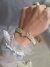 Pulsera plata y oro centro corazón en internet