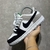 Nike Sb Dunk Low Pro, composto em material camurça nas cores cinza, preto e branco.