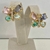 BRINCO BORBOLETA COM PEDRAS COLORIDAS BANHADO A OURO 18K