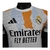 Camisa Real de Madrid Pré-jogo 25/26 - Jogador Adidas Masculina - Branca com detalhes em laranja e preto e azul na internet
