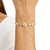 PULSEIRA FLORES ZIRCÔNIAS CRISTAL INTERCALADAS GRÃOS BANHADA A OURO 18K 19CM SEM ZIRCÔNIA - comprar online