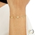 PULSEIRA FEMININA ESTRELAS E CORAÇÕES 19CM BANHADA A OURO 18K SEM ZIRCÔNIA - comprar online
