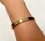 Bracelete dourado de metal de n. sra. aparecida