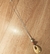 Colar artesanal de gota vazada e fio dourado - comprar online