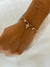 Pulseira crucifixo + cristal pendurado - comprar online