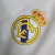 Jaqueta Corta-Vento Real Madrid 2023 - Masculina Adidas - Branca com detalhes em azul - loja online
