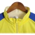 Imagem do Jaqueta Corta-Vento Al-Nassr 23/24 dupla face - Masculina Dunes - Amarela com detalhes em azul