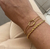 kit 2 pulseiras douradas