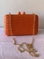 Clutch Matelassê Trançada na internet
