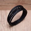 BRACELETE AÇO 20CM COURO PRETO 4 TIRAS TRANÇADAS 1 LISA C/ DET. GIRATÓRIO BLACK