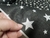 Imagem do TNT Estampado Mewi Estrela Branca Fundo Preto Metro
