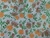 TNT Estampado Mewi Flores Marrom e Laranja Metro - loja online