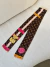 TWILLY LV MARROM MONOGRAM