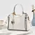 BOLSA ELEGANTE PINGENTE CORAÇÃO ABA TRANÇADA YNMY/ COD.B141 - loja online