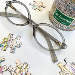 Armação de grau acetato oval cinza translúcido - Óticas Clover