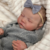 Arya Bebê Reborn Realista de 49cm, Pele em Silicone Suave e Flexível, Veias Detalhadas, Pintura Manual, Cabelos Encantadores e Expressão Serena - comprar online