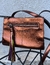 bolsa cobre metalizada Arezzo