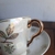 Taza de té suelta blanca - Anticuario Los Abuelos