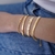 BRACELETE AMORE CRAVEJADO EM ZIRCÔNIAS EM PRATA925 COM BANHO DE OURO 18K - comprar online